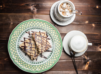 coffee americano with beans on wooden table
