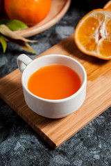 Fresh orange fruits and juice on marble table. Flat lay.