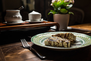 coffee americano with beans on wooden table
