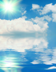 Surface water ripple and reflection of soft sky and clouds backg