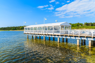 A white restaurant building on Jurata pier on Hel peninsula, Baltic Sea, Poland