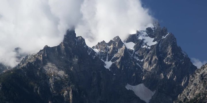 timelapse clouds on the peaks of mountains at Grand Teton National Park