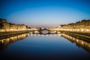 reflections in the arno river in florence