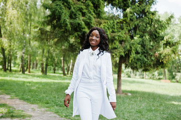 Portrait of stylish black african american girl stay on green pa