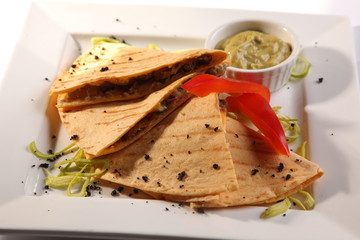 Mexican Tortilla with meat sauce and guacamole