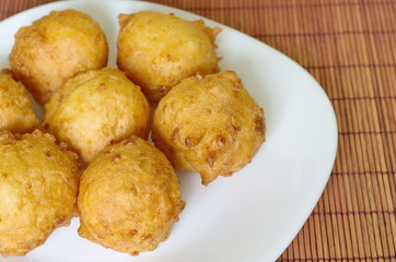 Homemade cottage cheese donuts on a plate closeup