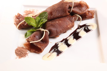 chocolate pancake with cream and fruit