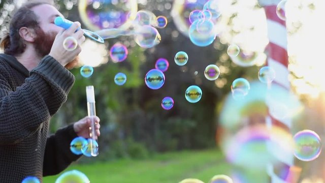 Blowing bubbles at sunset