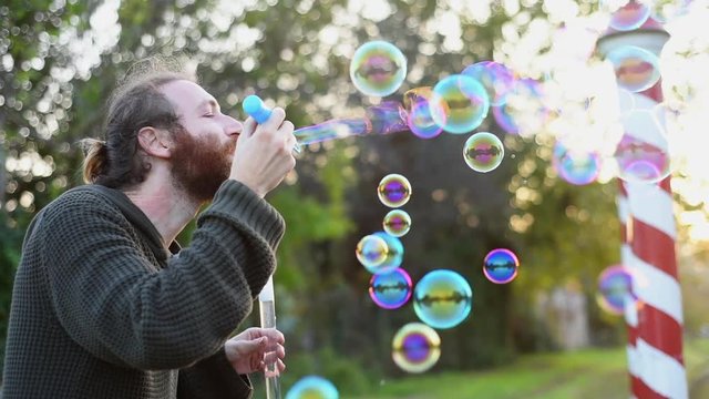 Blowing bubbles at sunset