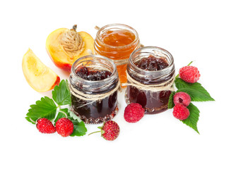 Jam in glass jars and berries