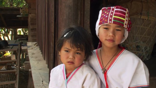 Portrait of two young Thai girls in traditional clothes