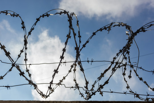 Prison barbed wire. Prison fence. Strict punishment for crimes