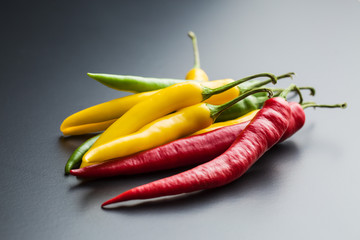 Different colors chili peppers.