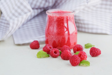 Delicious raspberry smoothie or milk shake with fresh berries. F