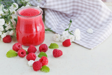 Delicious raspberry smoothie or milk shake with fresh berries. F