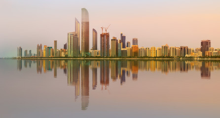 Fototapeta na wymiar View of Abu Dhabi Skyline at sunset, UAE