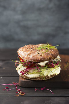 Veggie Burger, vegan, with salad, radish, tomato, rock chive
