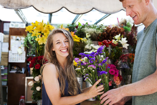 Man gifting flowers to his girlfriend