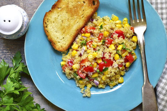 Quinoa salad with bell pepper,tomatoes,red onion,sweet corn and