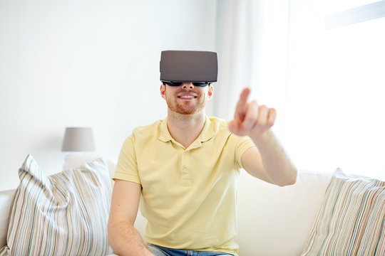 young man in virtual reality headset or 3d glasses