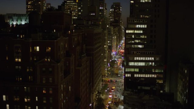 High angle wide shot of cityscape at night / New York, New York, United States