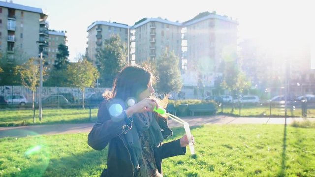 Woman blowing bubbles
