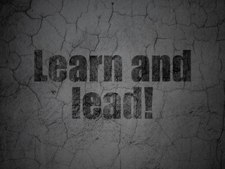 Studying concept: Learn and Lead! on grunge wall background