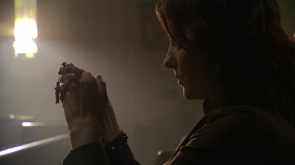 Close view of woman holding rosary and praying