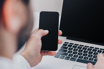Young businessman working with modern devices