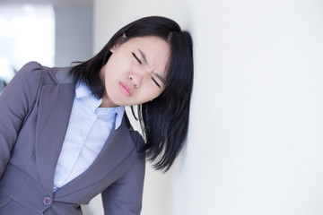 Unhappy thinking business woman