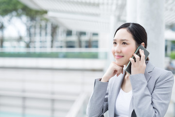 business woman speak smart phone