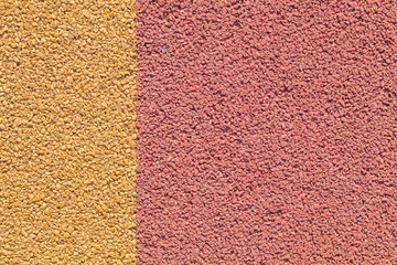 Colorful red and yellow Rubber Wetpour playground floor surface.