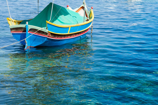 Traditional Maltese fishing boat, St Thomas Bay, Marsascala, Mal © mikesmithdesign