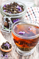 cup  of tea with willow-herb on wooden background