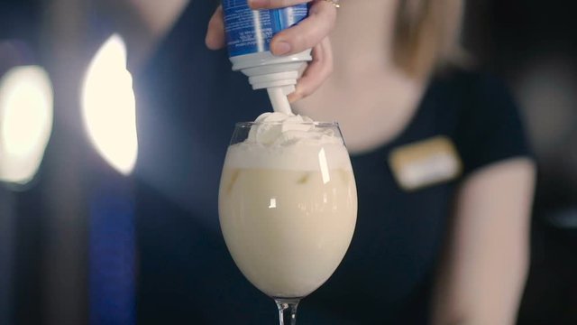 Cream is Added to the Cocktail