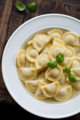 Close-up of ravioli in bouillon, view from above