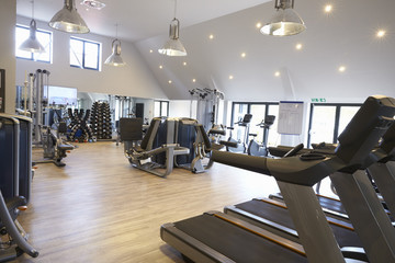 Empty gym with modern fitness equipment