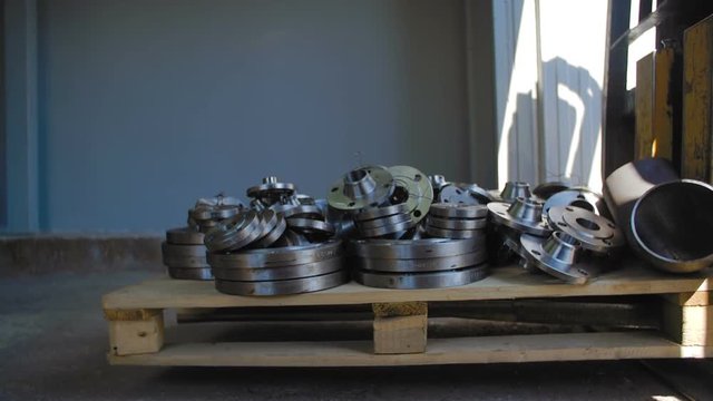 Forklift Brings Plywood Pallet with Flanges