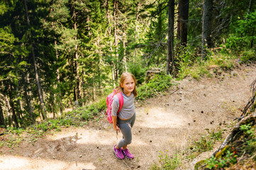 Little hiker girl in forest. Photo from Champex-Lac, Valais, swiss Alps, top view