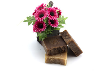 Soap spa with Artificial flowers on white isolated