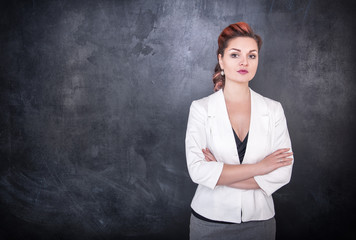 Beautiful teacher on chalkboard blackboard background