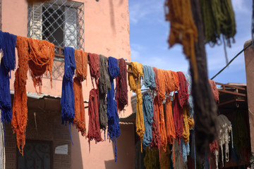 Fototapeta na wymiar The hand-colored fabrics, laid out to dry