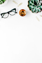 feminine desk workspace with succulent, retro camera, scissors, diary and golden clips on white background. flat lay, top view