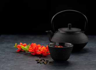 Obraz na płótnie Canvas Tea Asian background. Cast iron teapot and cup green tea.
