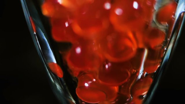 Tea Bubbles Falls in Glass Slow Motion