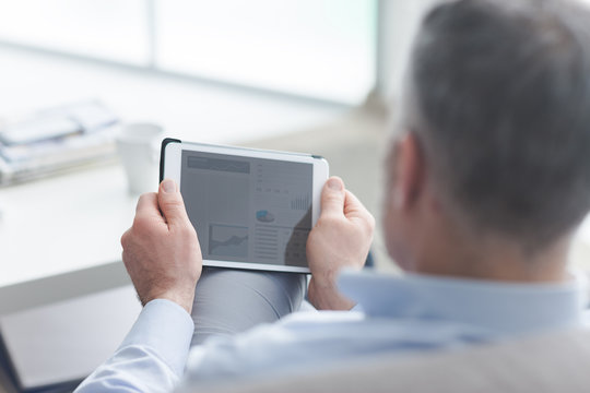 Man using a touch screen tablet