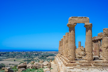 Fototapeta na wymiar Colonnade of Hera (Juno) temple in Agrigento. Sicily, Italy