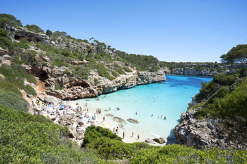 Beautiful turquoise clear water at Majorca beach, Calo des Moro, Spain