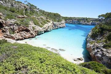Beautiful turquoise clear water at Majorca beach, Calo des Moro, Spain