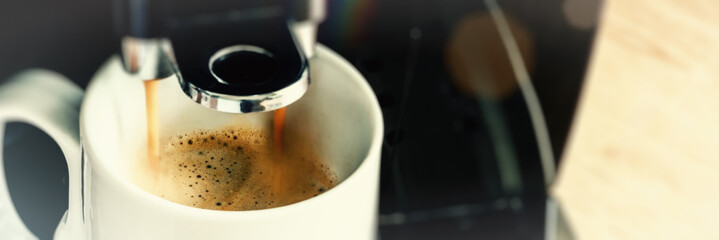 Close up of coffee maker machine pouring brewed hot Espresso - 114734890